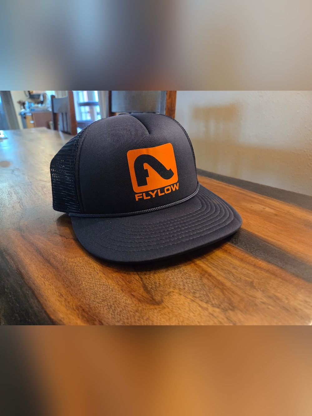Flylow Men's Black Trucker Hat with Orange Logo